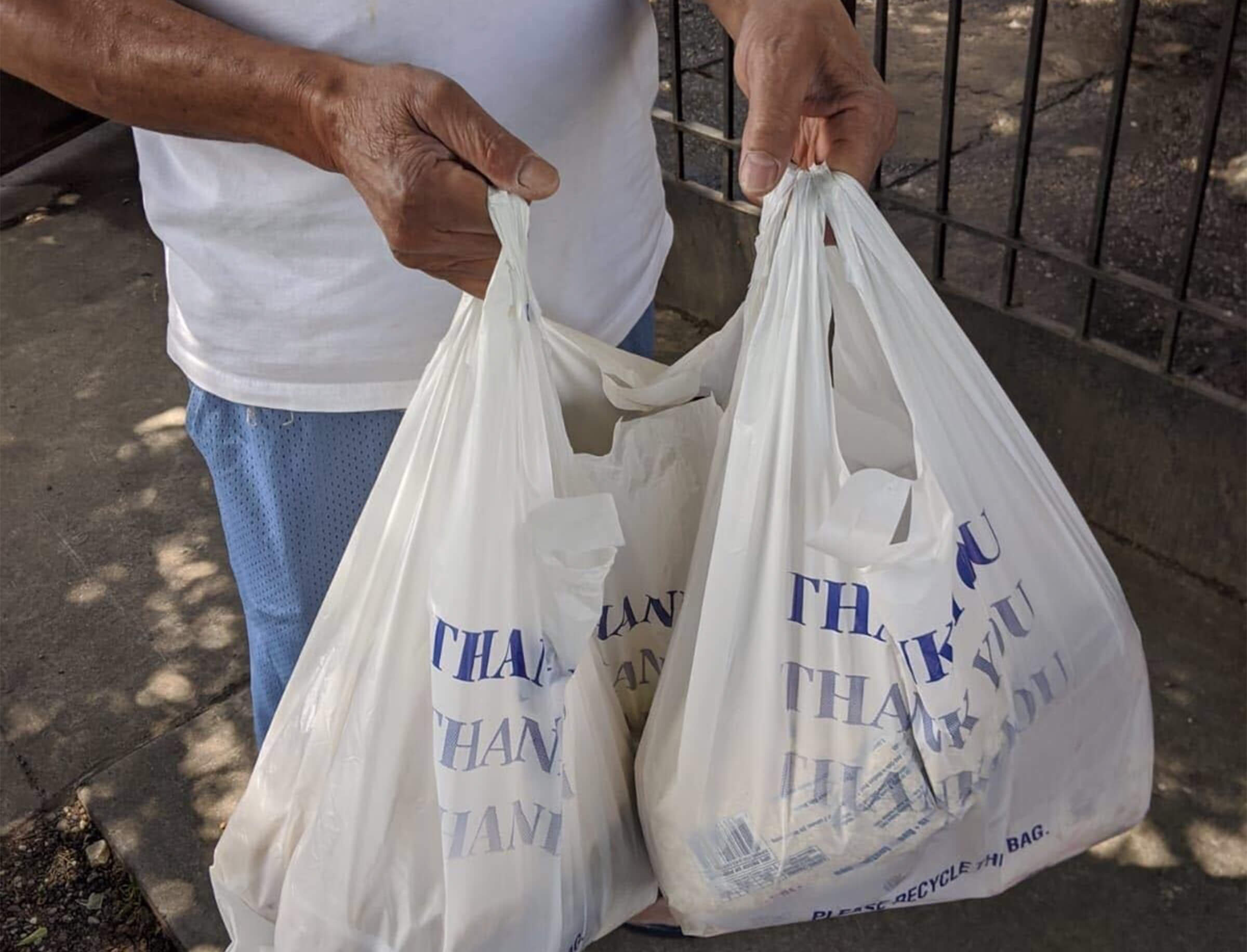 Volunteer holding bags for distribution
